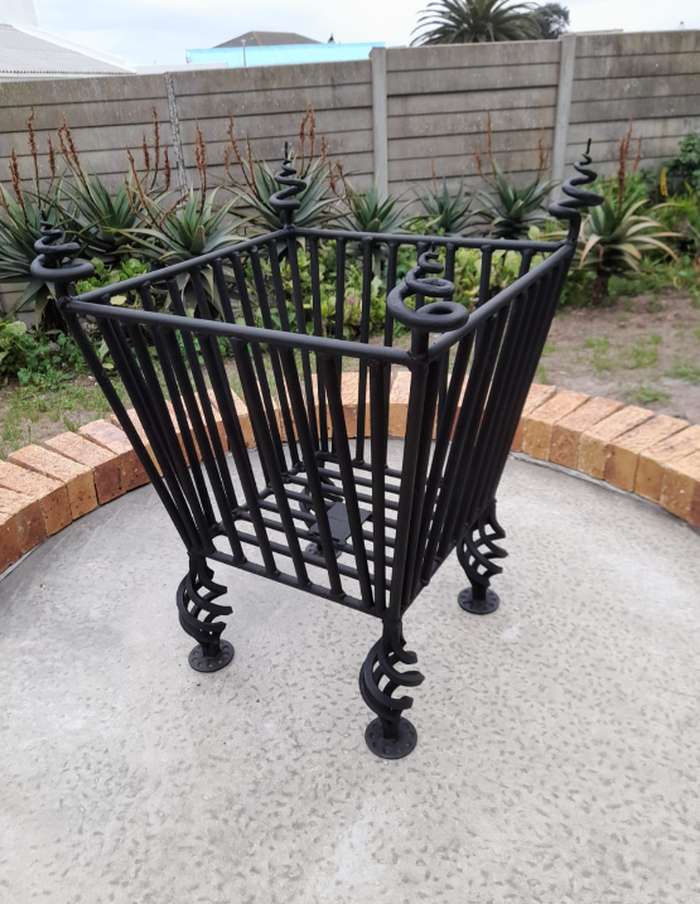 Custom-made black steel with spiral legs and finials